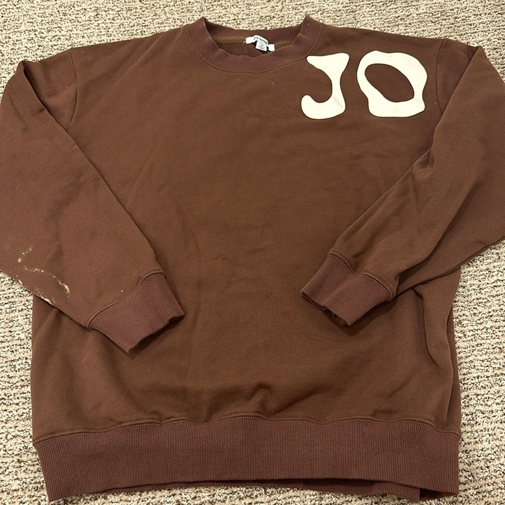 Jo West sweatshirt with a small bleach stain, see photos